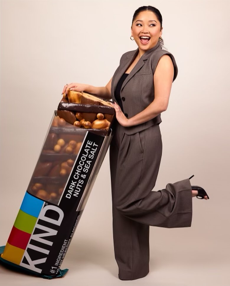 Lana Condor posing with oversized KIND bar